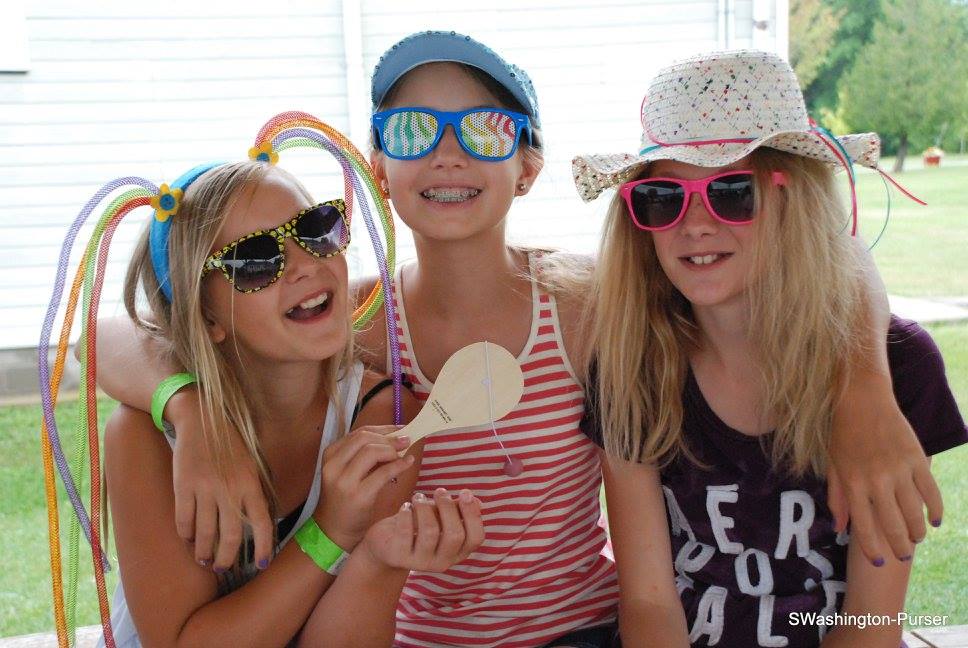 Campers wearing silly hots and sun glasses